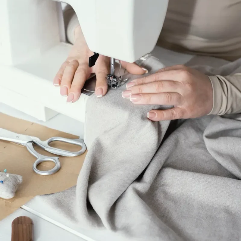high-angle-seamstress-using-sewing-machine Large